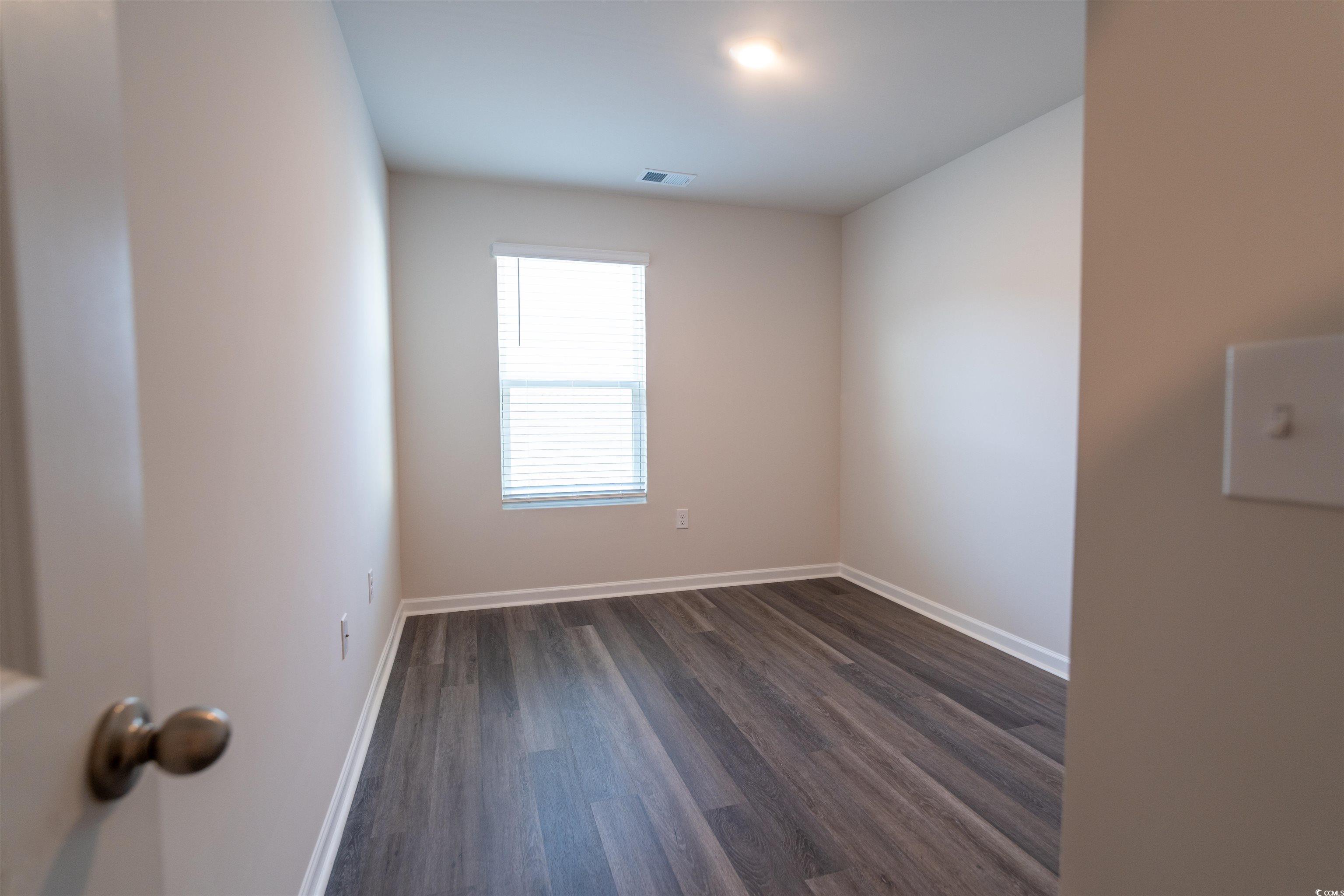 160 Harvest Gold Drive Conway, SC 29526 - Photo 28 of 37 Unfurnished room with dark wood-style floors and baseboards