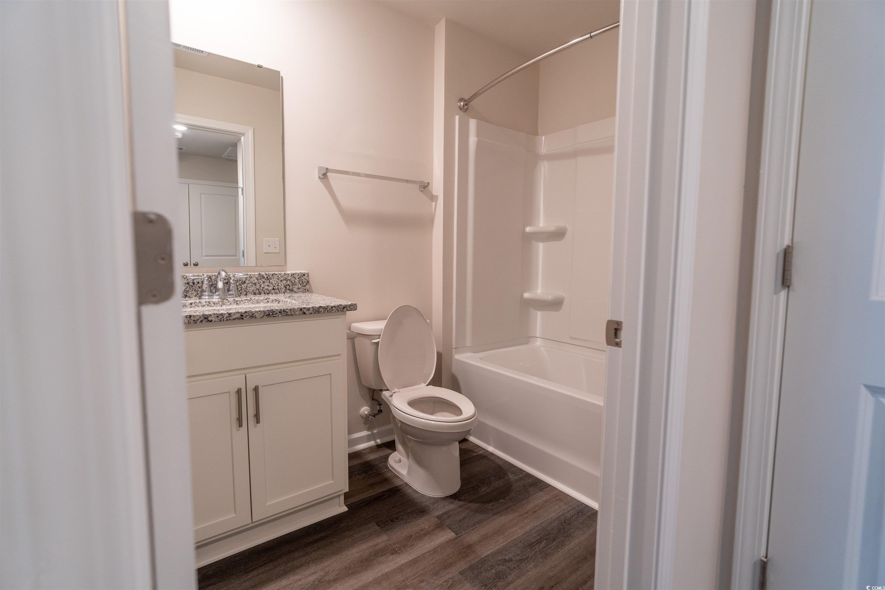 160 Harvest Gold Drive Conway, SC 29526 - Photo 29 of 37 Bathroom with vanity, dark wood-style floors, and tub / shower combination