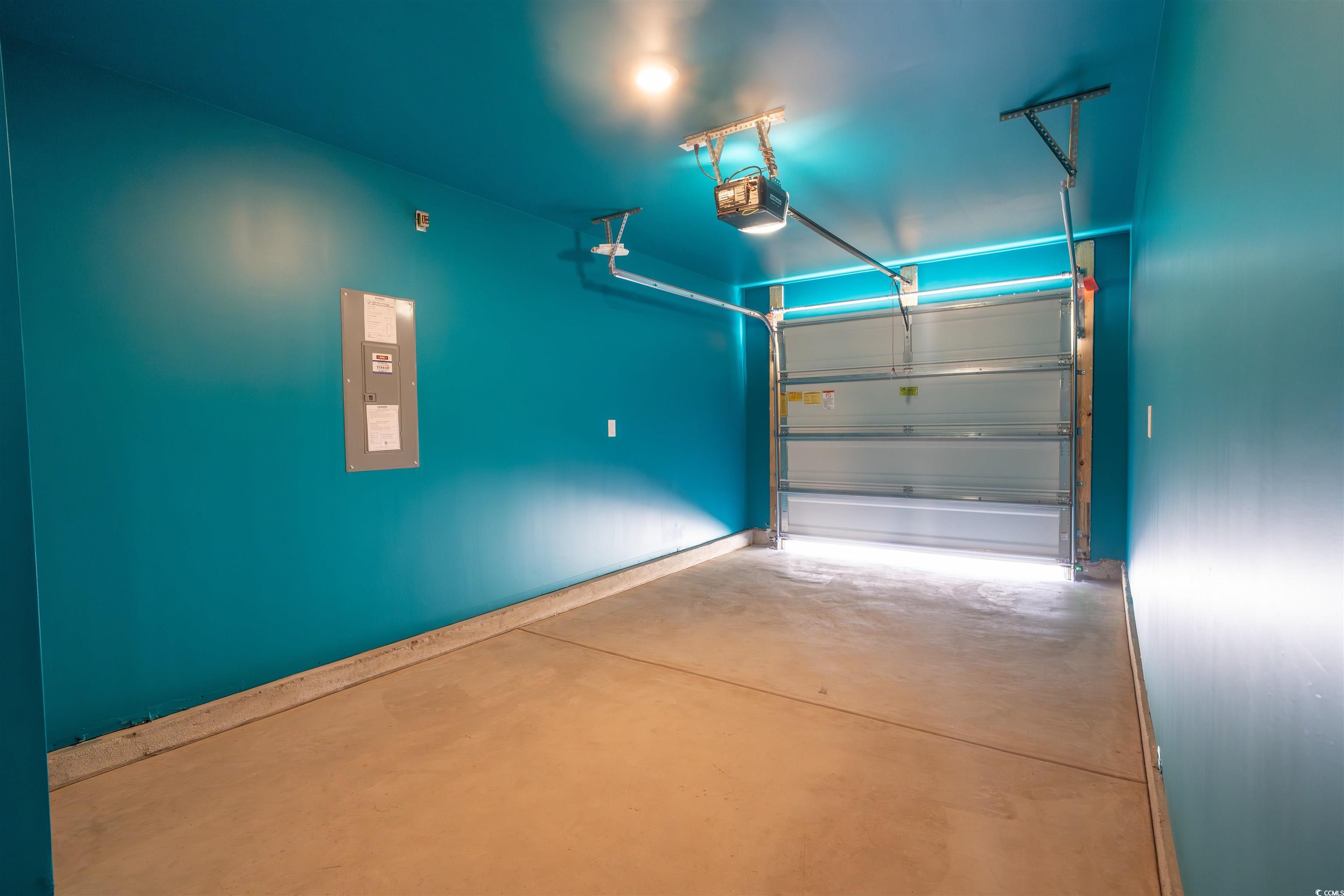 160 Harvest Gold Drive Conway, SC 29526 - Photo 34 of 37 Garage with electric panel and a garage door opener