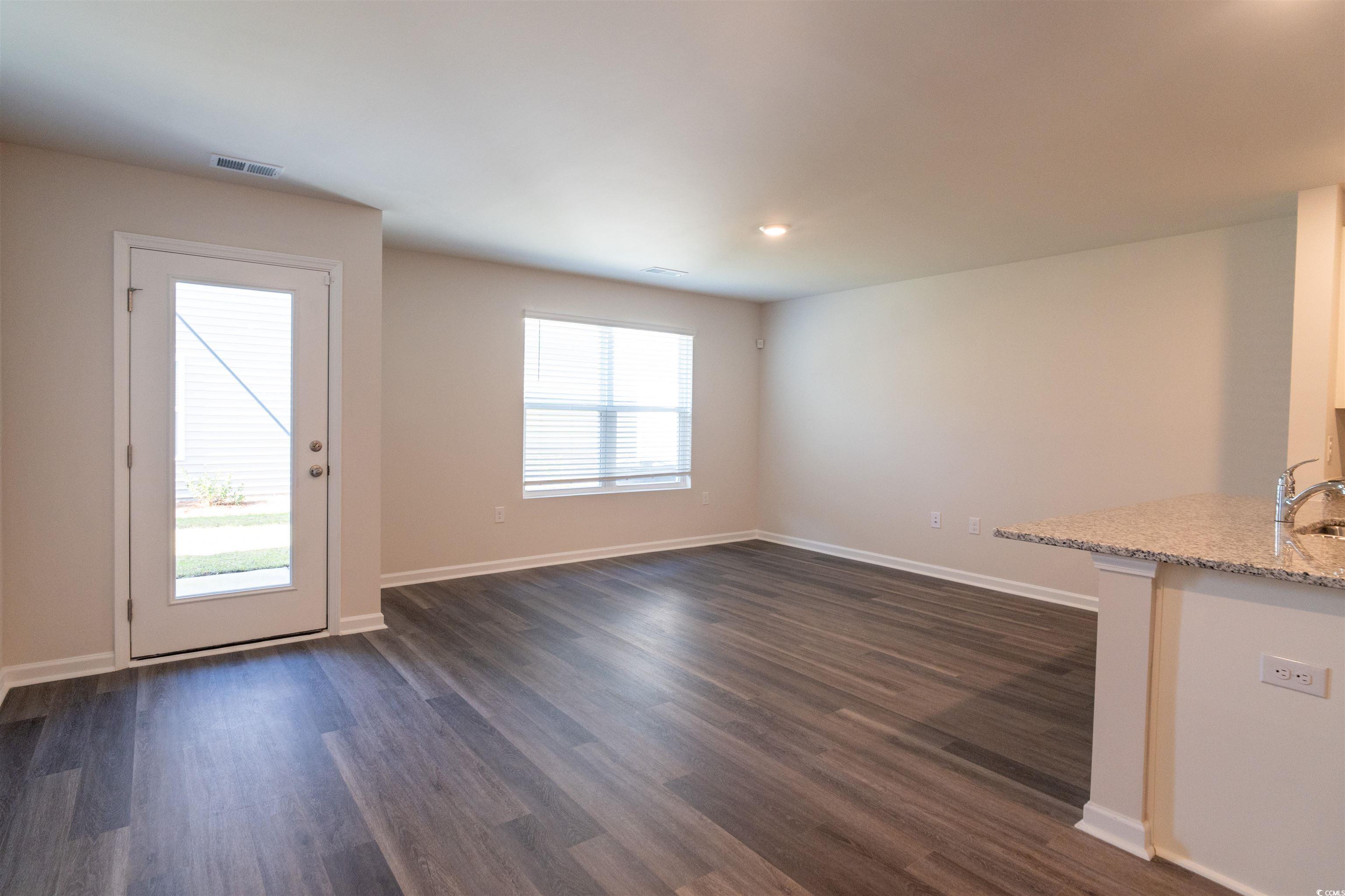 160 Harvest Gold Drive Conway, SC 29526 - Photo 6 of 37 Unfurnished living room featuring dark wood finished floors and recessed lighting