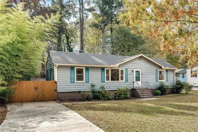 front view of a house next to a yard