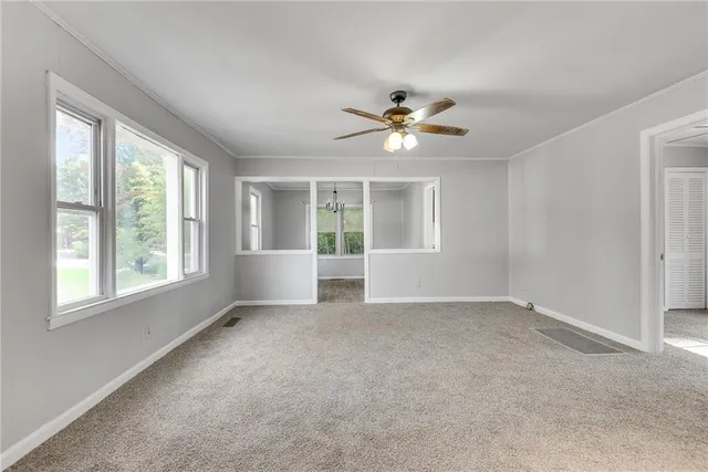 a view of an empty room with a window