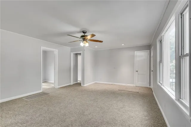 a view of an empty room with a window