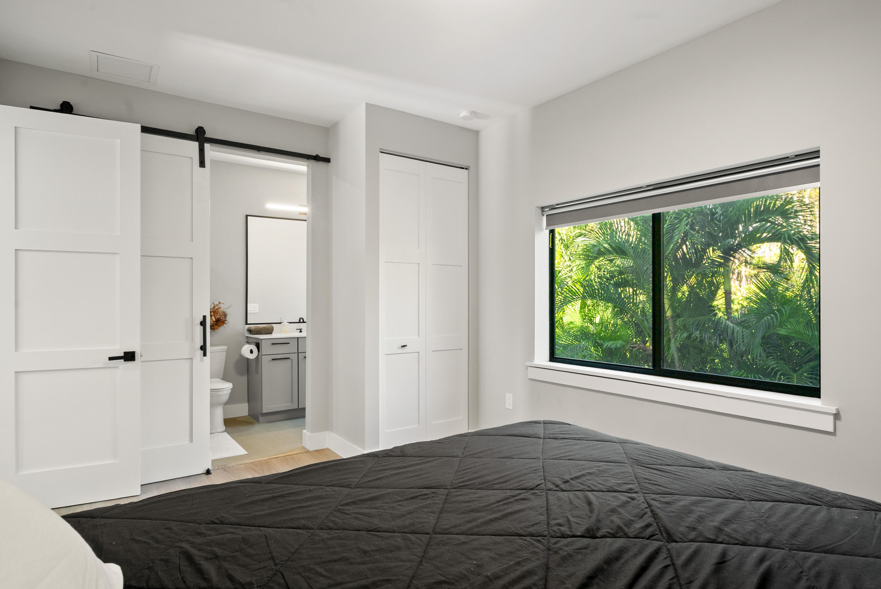 13 Coral Way Key Largo, FL 33037 - Photo 15 of 34 a bedroom with a bed and a large window