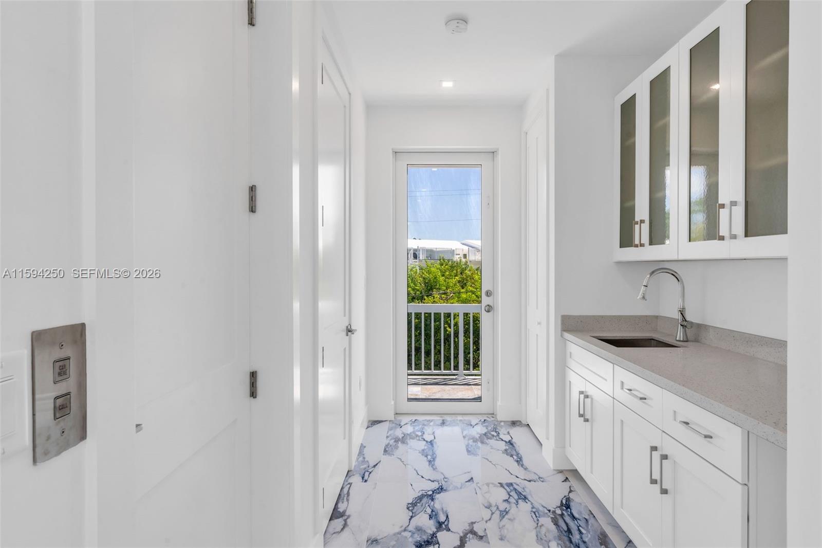 84 Coral Way Key Largo, FL 33037 - Photo 23 of 55 a bathroom with a granite countertop sink and a window