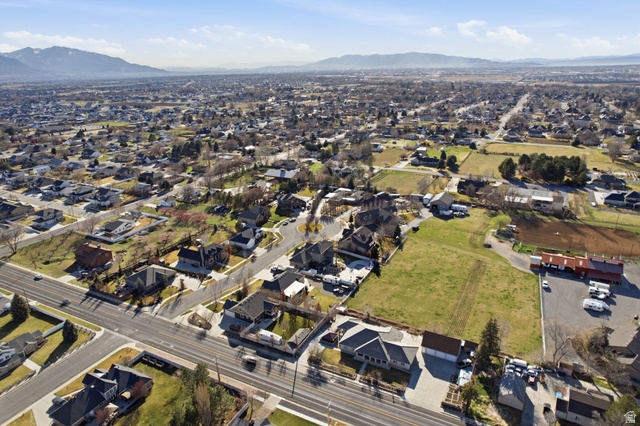 145 Carnesecca Court Mapleton, UT 84664 - Photo 103 of 109 Aerial view of property and surrounding area featuring a mountainous background and nearby suburban area