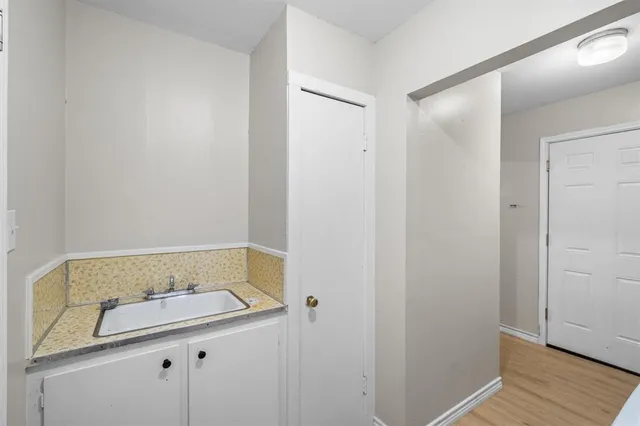 a bathroom with a sink and vanity