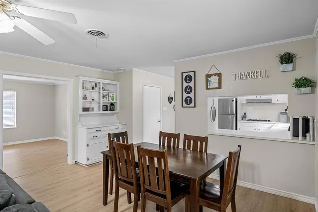 a dining room with furniture and window