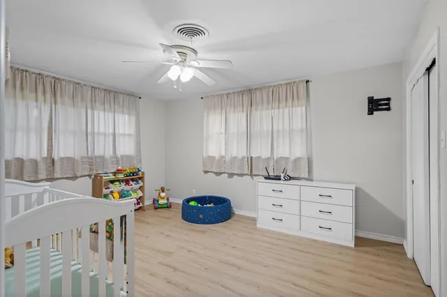 a view of a bedroom with furniture and toys