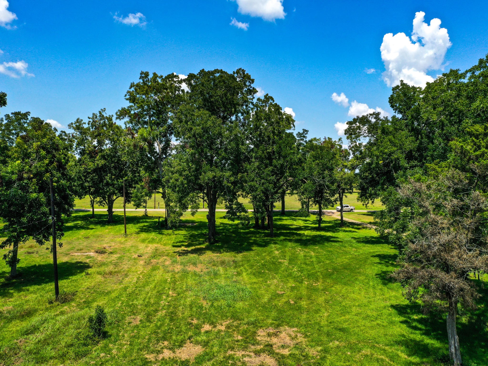 0 Texas Avenue Boling, TX 77420 - Photo 11 of 22 a backyard of a house with lots of green space and fountain