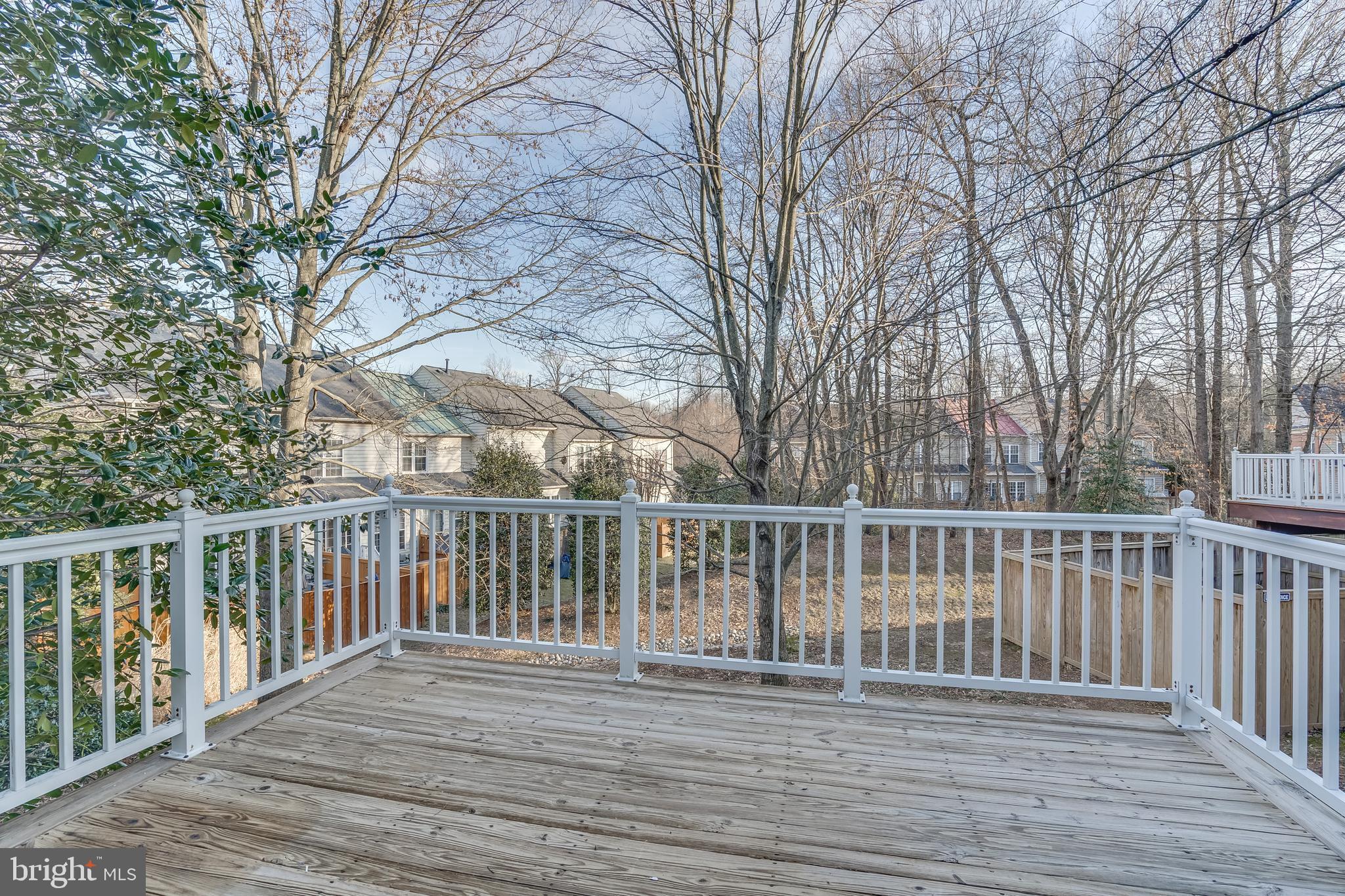 11439 Heritage Commons Way Reston, VA 20194 - Photo 14 of 38 Large Deck Overlooking Trees and Common Area