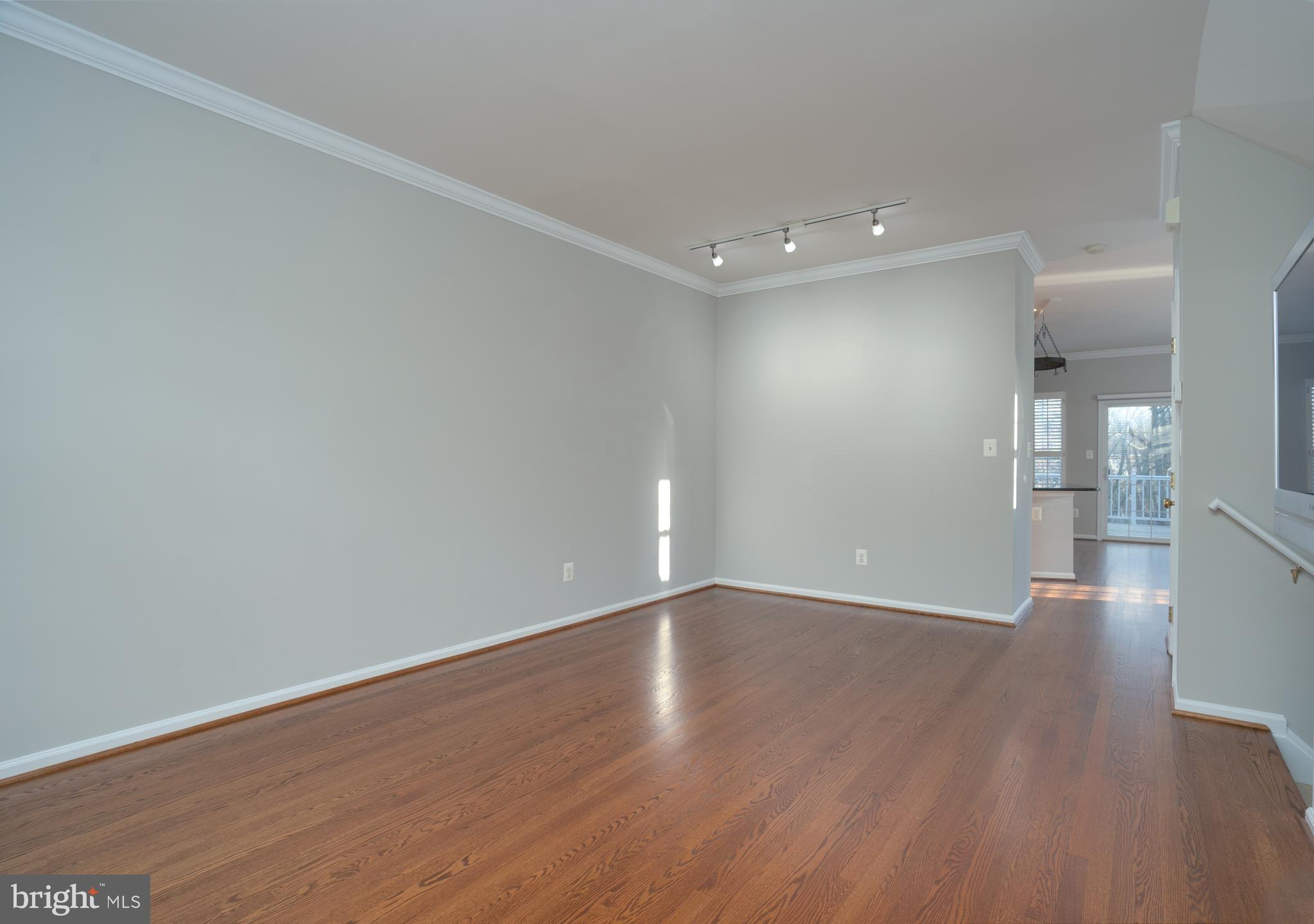 11439 Heritage Commons Way Reston, VA 20194 - Photo 7 of 38 Living Room with TV convey as is