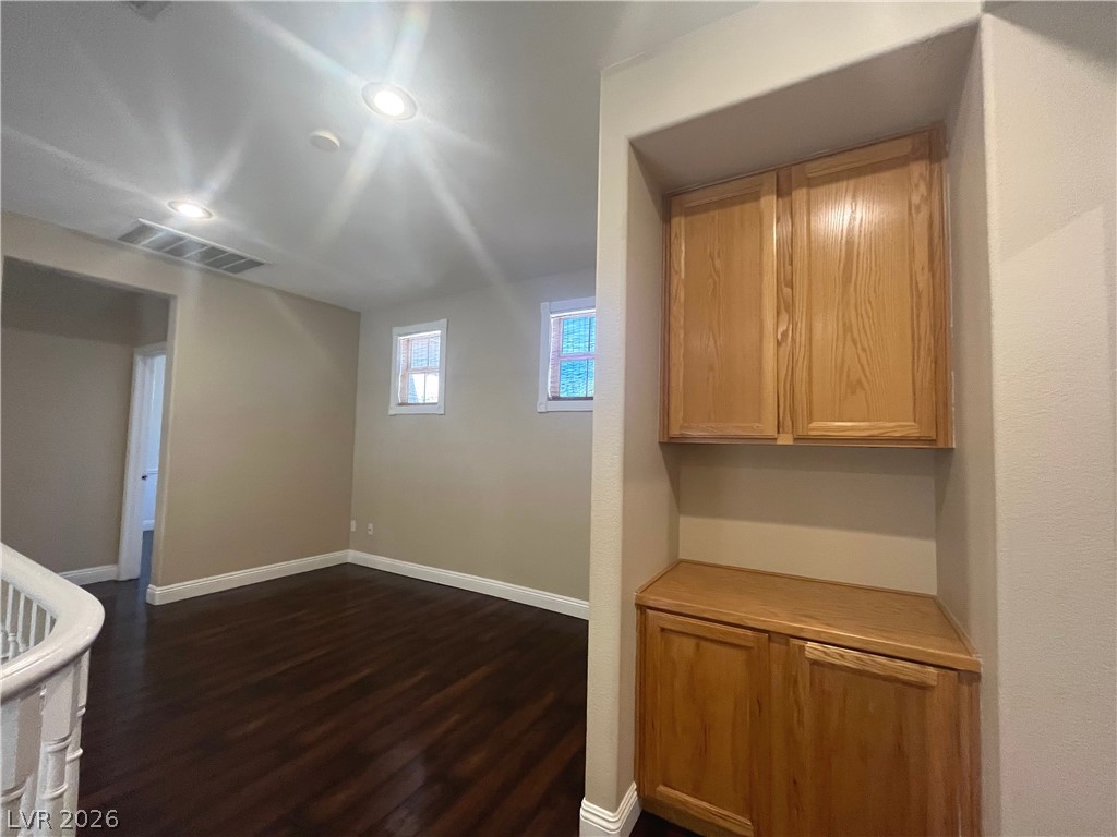 1809 Snow Spring Lane Las Vegas, NV 89134 - Photo 25 of 75 The upstairs loft is positioned to create privacy between the primary bed & the add'l rooms w/linen cabinets.