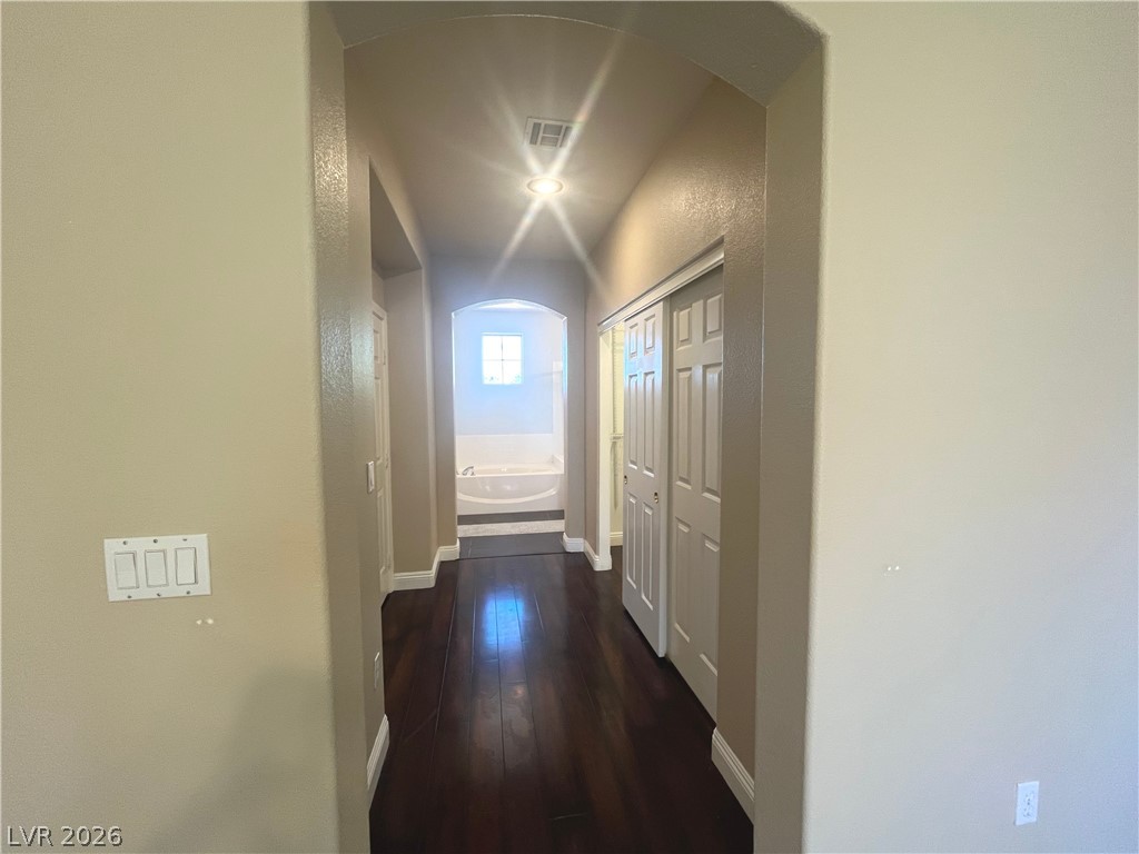 1809 Snow Spring Lane Las Vegas, NV 89134 - Photo 29 of 75 Primary bedroom w/ceiling fan & light, new carpet, two tone paint and walk in closet