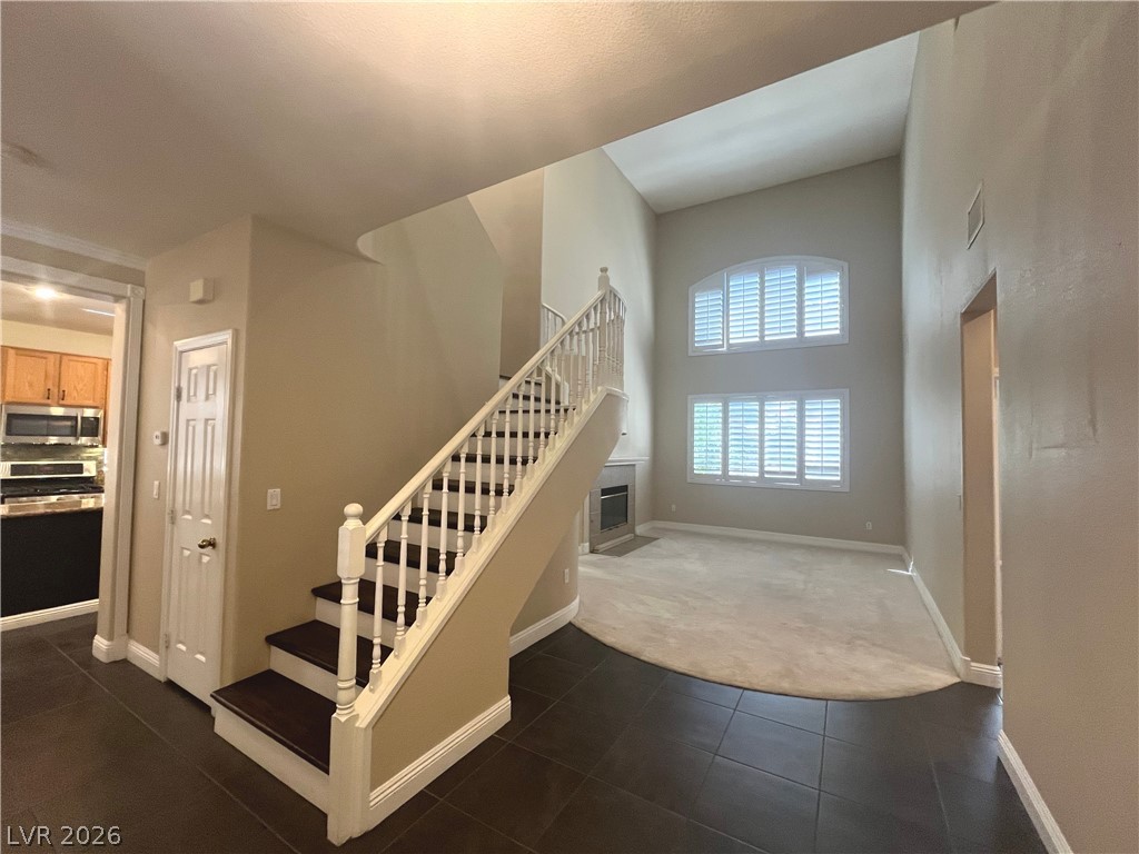 1809 Snow Spring Lane Las Vegas, NV 89134 - Photo 3 of 75 Entry welcomes you ceramic tile floors & two tone paint