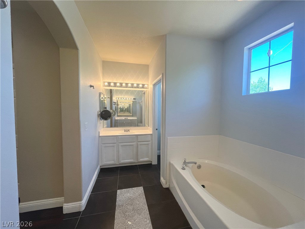 1809 Snow Spring Lane Las Vegas, NV 89134 - Photo 37 of 79 Primary bath w/dual sinks, sep tub & shower, ceramic tile floors