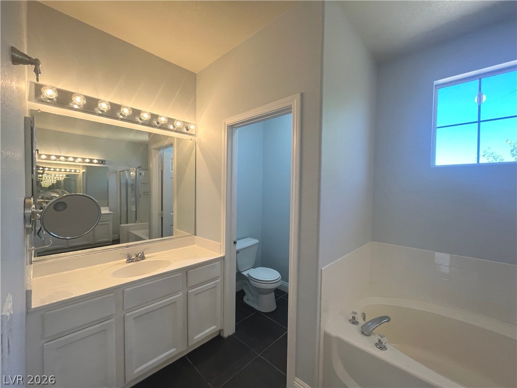 1809 Snow Spring Lane Las Vegas, NV 89134 - Photo 39 of 79 Primary bath w/dual sinks, sep tub & shower, ceramic tile floors