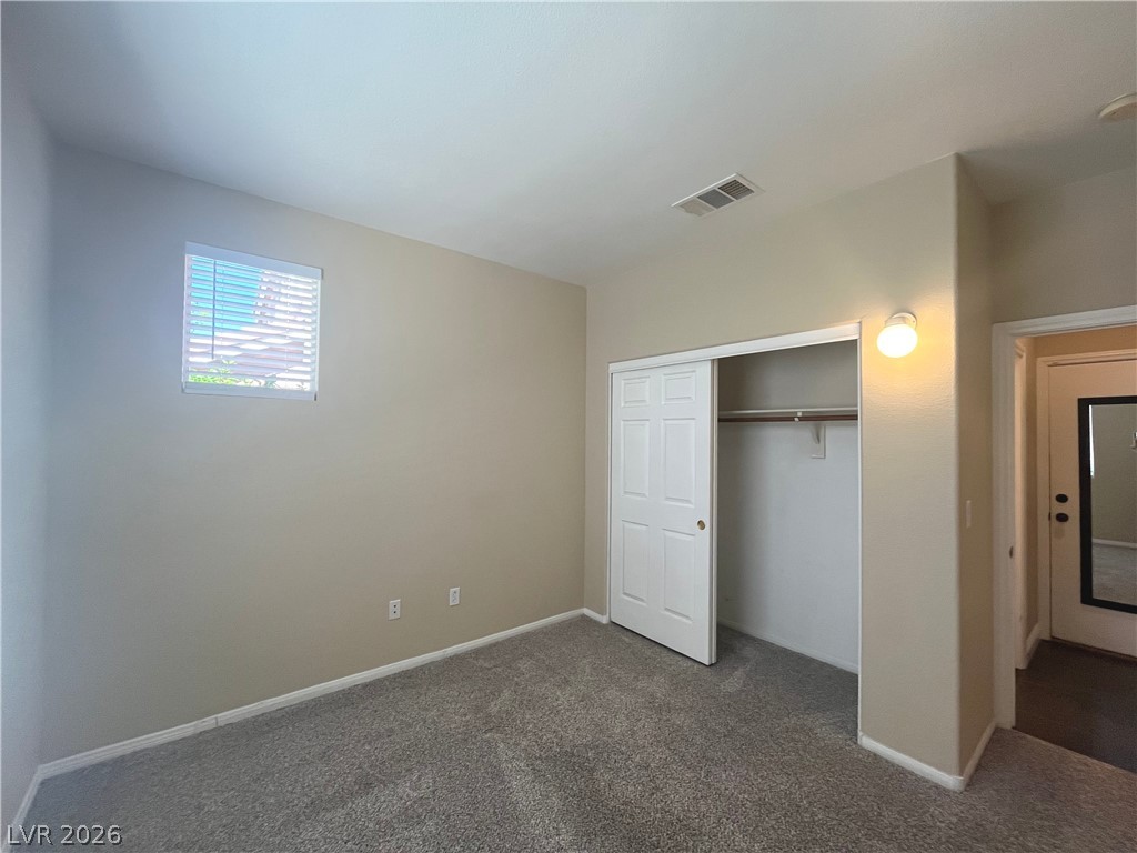 1809 Snow Spring Lane Las Vegas, NV 89134 - Photo 46 of 75 Bed 4 downstairs w/carpet, light and closet