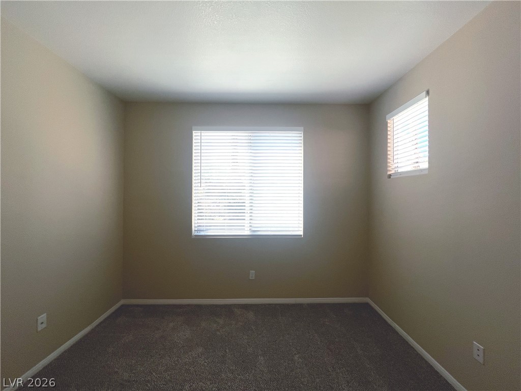 1809 Snow Spring Lane Las Vegas, NV 89134 - Photo 48 of 75 Bed 4 downstairs w/carpet, light and closet