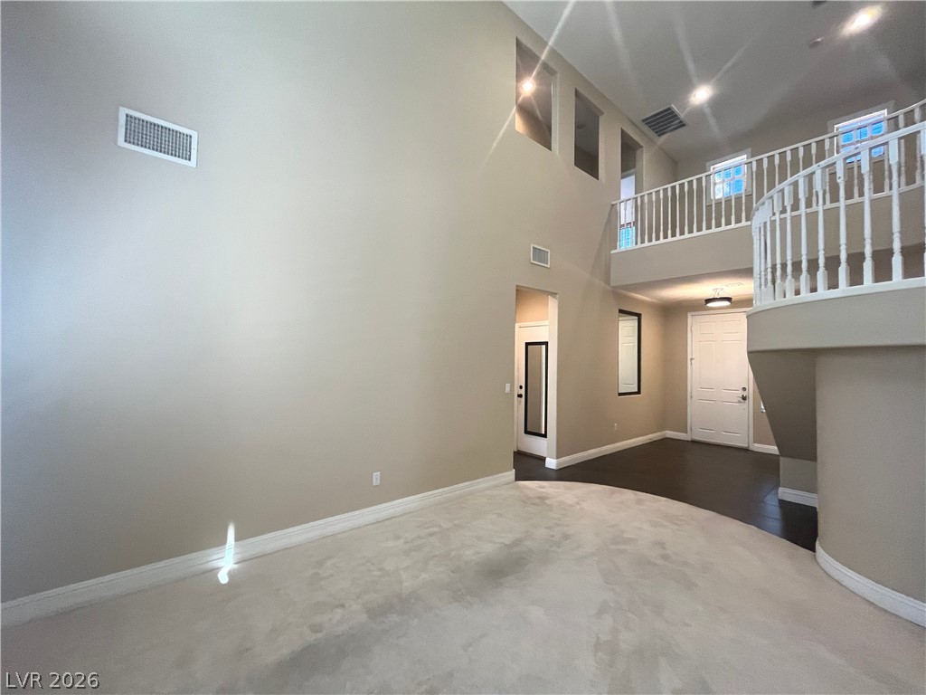 1809 Snow Spring Lane Las Vegas, NV 89134 - Photo 5 of 75 Formal living room welcomes you w/abundant natural light w/large windows w/plantation shutters & vaulted ceilings.
