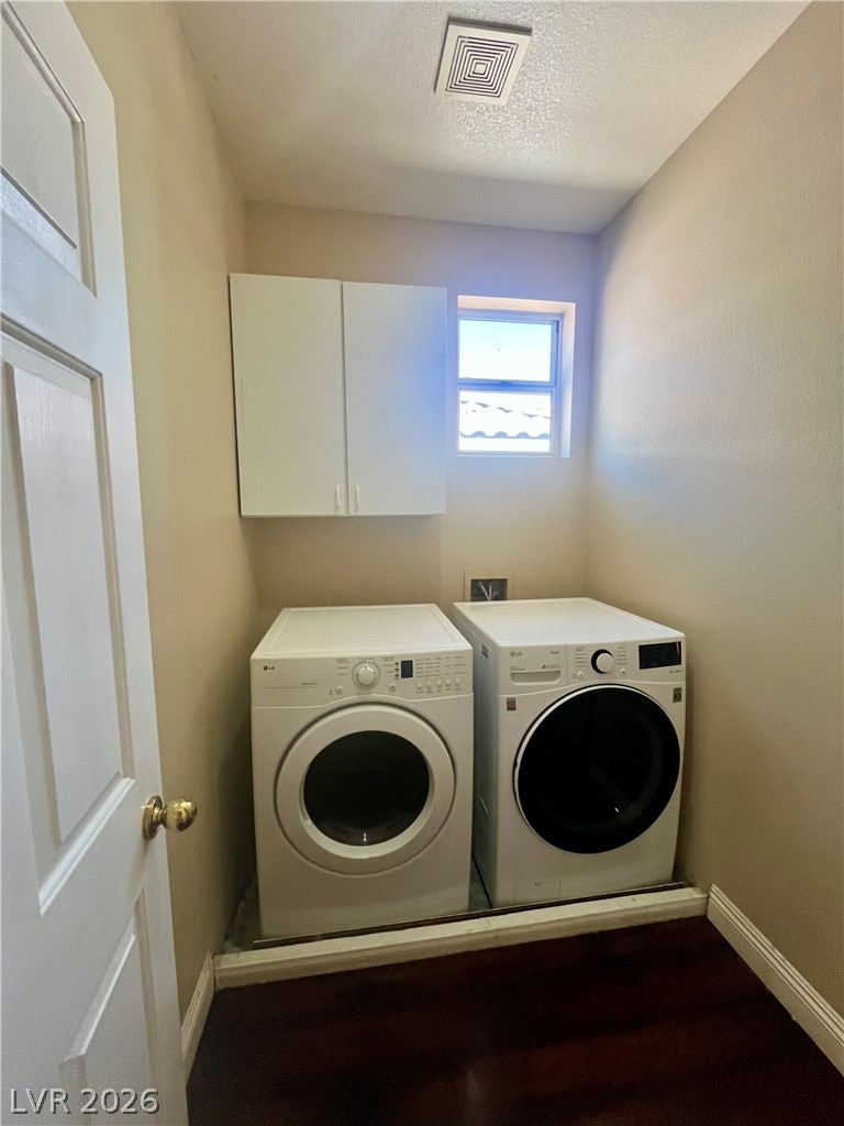 1809 Snow Spring Lane Las Vegas, NV 89134 - Photo 51 of 75 Laundry upstairs w/washer & dryer, sink and cabinets