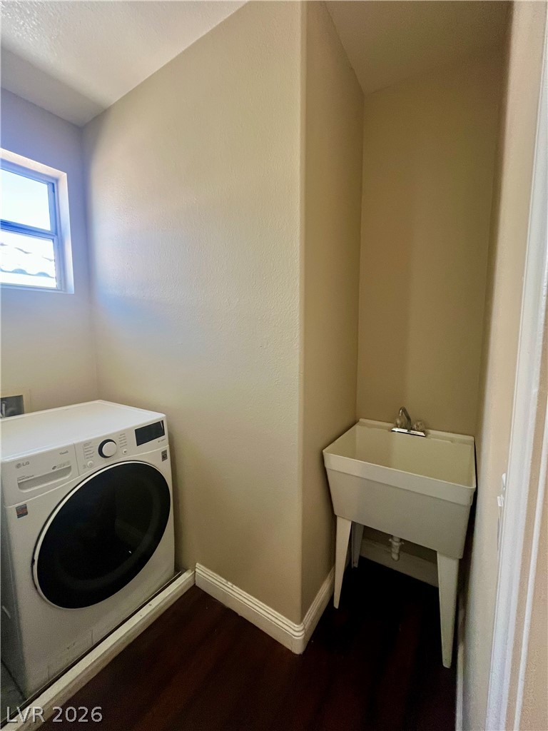 1809 Snow Spring Lane Las Vegas, NV 89134 - Photo 58 of 79 Laundry upstairs w/washer & dryer, sink and cabinets