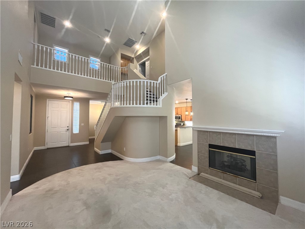 1809 Snow Spring Lane Las Vegas, NV 89134 - Photo 6 of 75 Formal living room welcomes you w/abundant natural light w/large windows w/plantation shutters & vaulted ceilings.