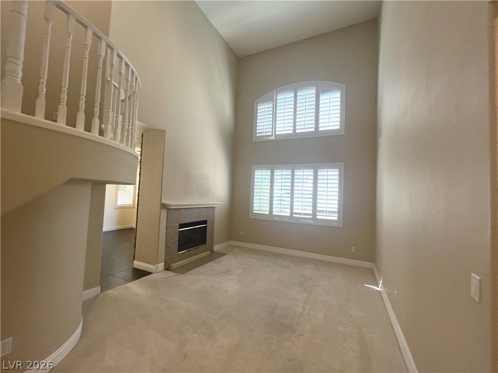 1809 Snow Spring Lane Las Vegas, NV 89134 - Photo 6 of 79 Formal living room welcomes you w/abundant natural light w/large windows w/plantation shutters & vaulted ceilings.