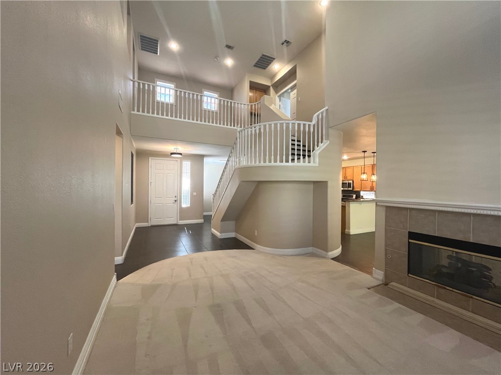 1809 Snow Spring Lane Las Vegas, NV 89134 - Photo 7 of 79 Formal living room welcomes you w/abundant natural light w/large windows w/plantation shutters & vaulted ceilings.