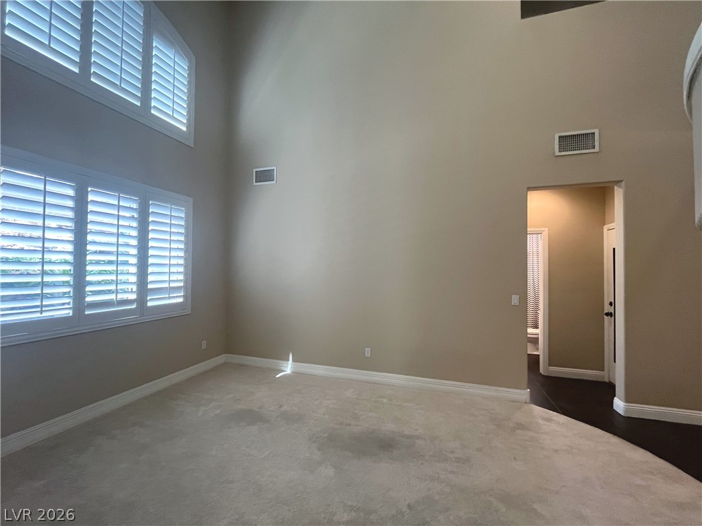 1809 Snow Spring Lane Las Vegas, NV 89134 - Photo 8 of 75 Formal living room welcomes you w/abundant natural light w/large windows w/plantation shutters & vaulted ceilings.