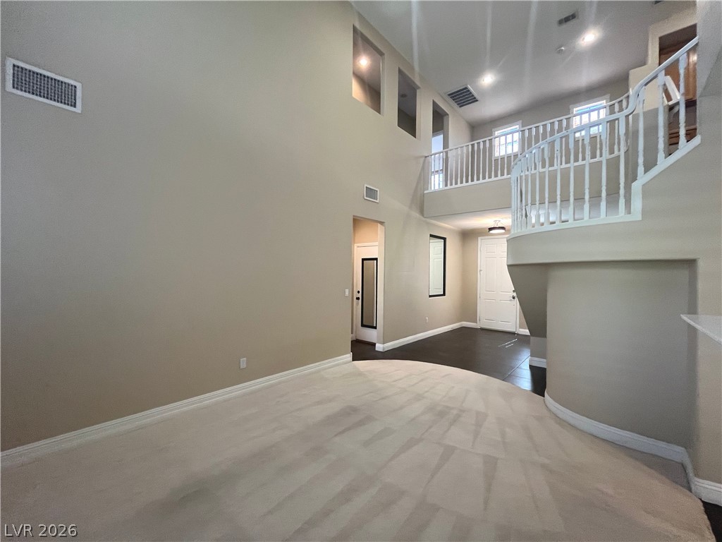 1809 Snow Spring Lane Las Vegas, NV 89134 - Photo 9 of 79 Formal living room welcomes you w/abundant natural light w/large windows w/plantation shutters & vaulted ceilings.
