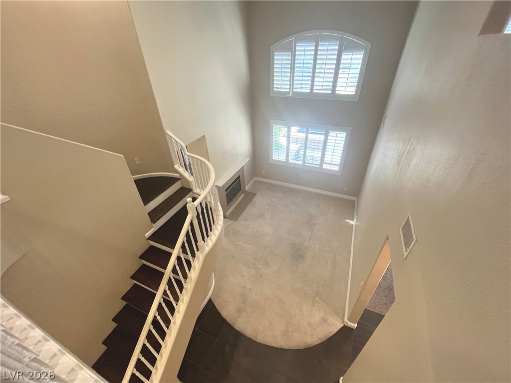 1809 Snow Spring Lane Las Vegas, NV 89134 - Photo 9 of 75 Formal living room welcomes you w/abundant natural light w/large windows w/plantation shutters & vaulted ceilings.