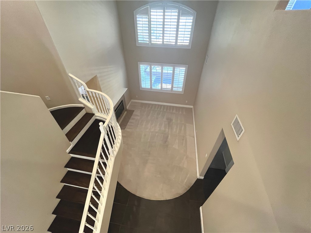 1809 Snow Spring Lane Las Vegas, NV 89134 - Photo 10 of 79 Formal living room welcomes you w/abundant natural light w/large windows w/plantation shutters & vaulted ceilings.