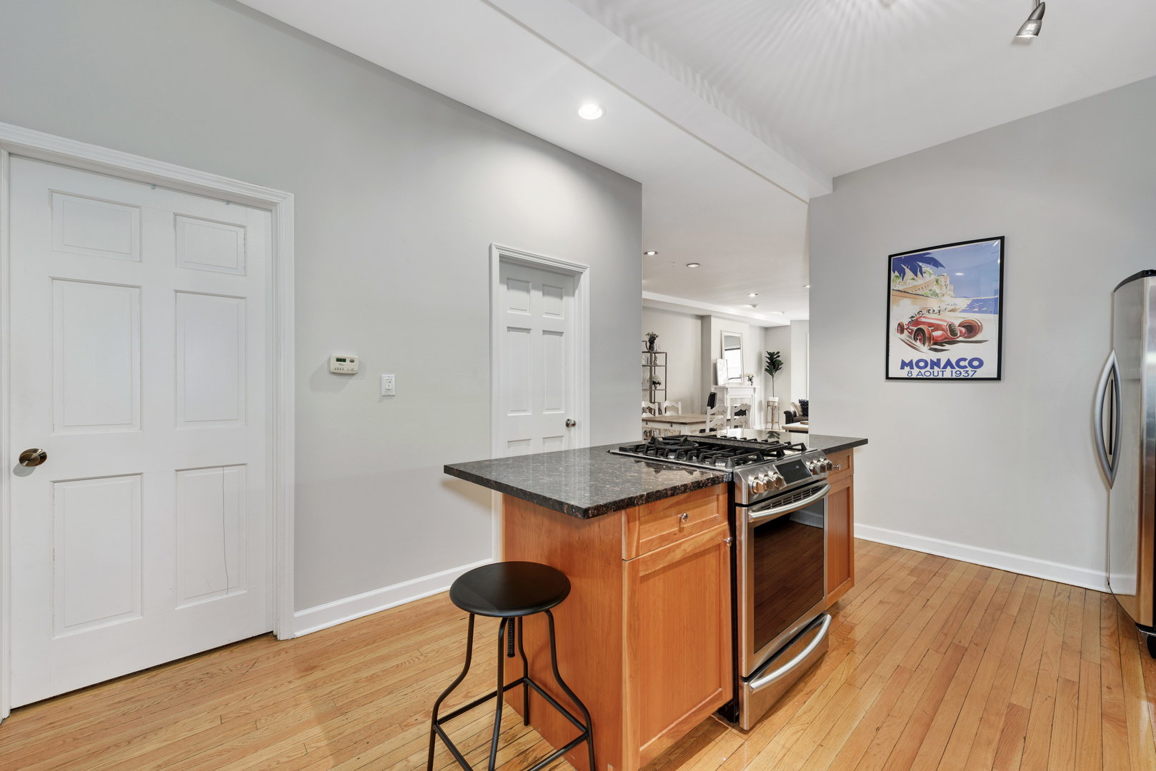 15 East Division Street, Unit 2W Chicago, IL 60611 - Photo 12 of 20 a kitchen with stainless steel appliances granite countertop a stove and a refrigerator