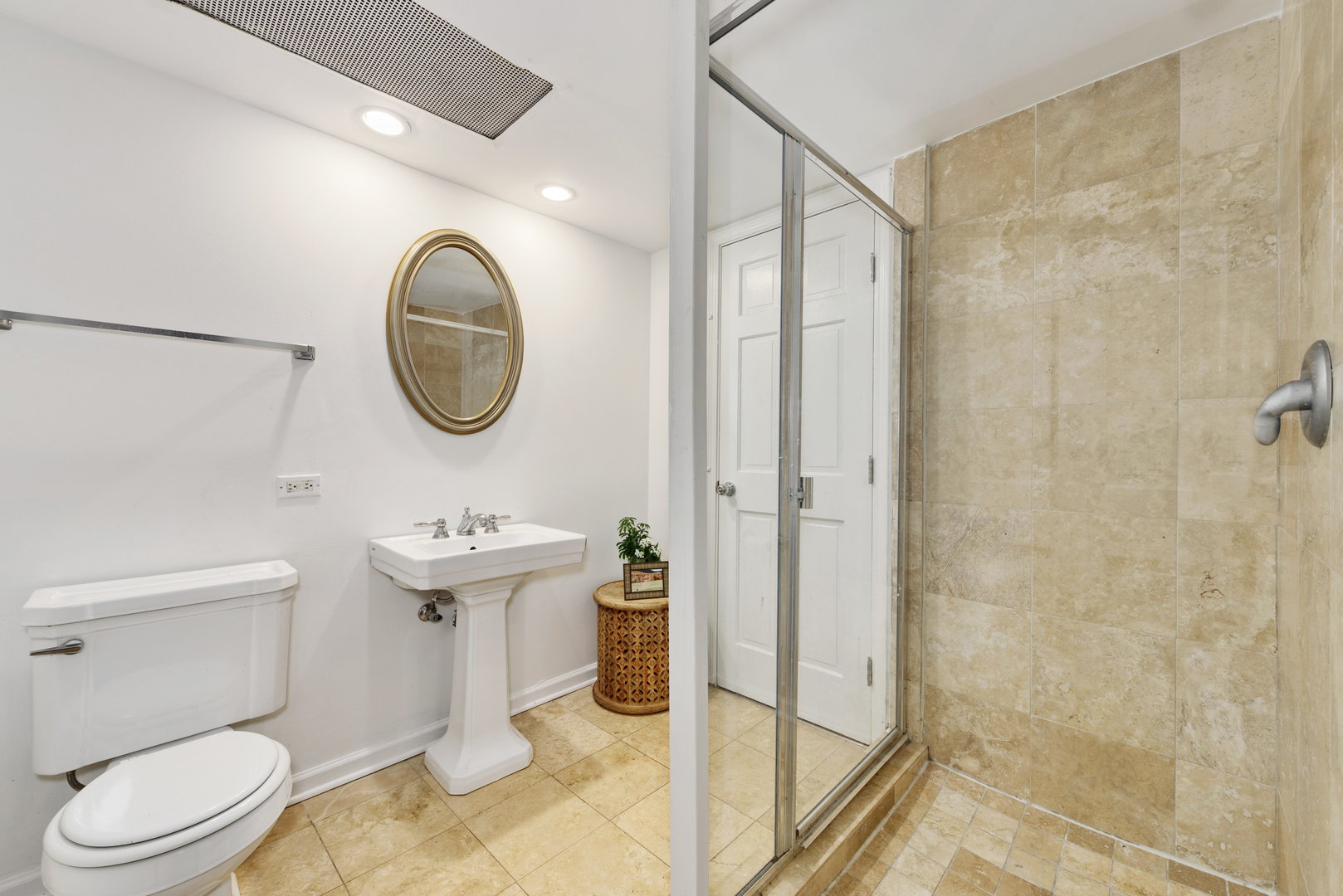 15 East Division Street, Unit 2W Chicago, IL 60611 - Photo 17 of 20 a bathroom with a sink a toilet and a mirror