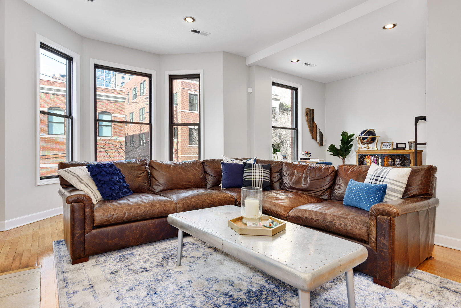 15 East Division Street, Unit 2W Chicago, IL 60611 - Photo 4 of 20 a living room with furniture and a large window