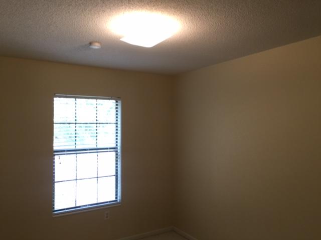 2055 Christensen Drive Navarre, FL 32566 - Photo 18 of 25 an empty room with a window