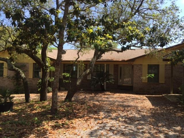 2055 Christensen Drive Navarre, FL 32566 - Photo 2 of 25 a front view of a house with a yard