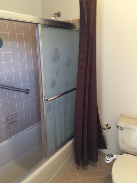 2055 Christensen Drive Navarre, FL 32566 - Photo 22 of 25 a bathroom with a toilet and a shower
