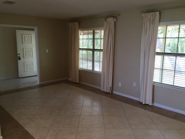 2055 Christensen Drive Navarre, FL 32566 - Photo 5 of 25 an empty room with windows