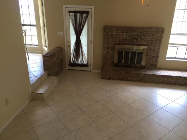2055 Christensen Drive Navarre, FL 32566 - Photo 6 of 25 an empty room with windows
