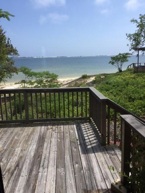 2055 Christensen Drive Navarre, FL 32566 - Photo 10 of 25 a view of balcony with wooden floor and fence