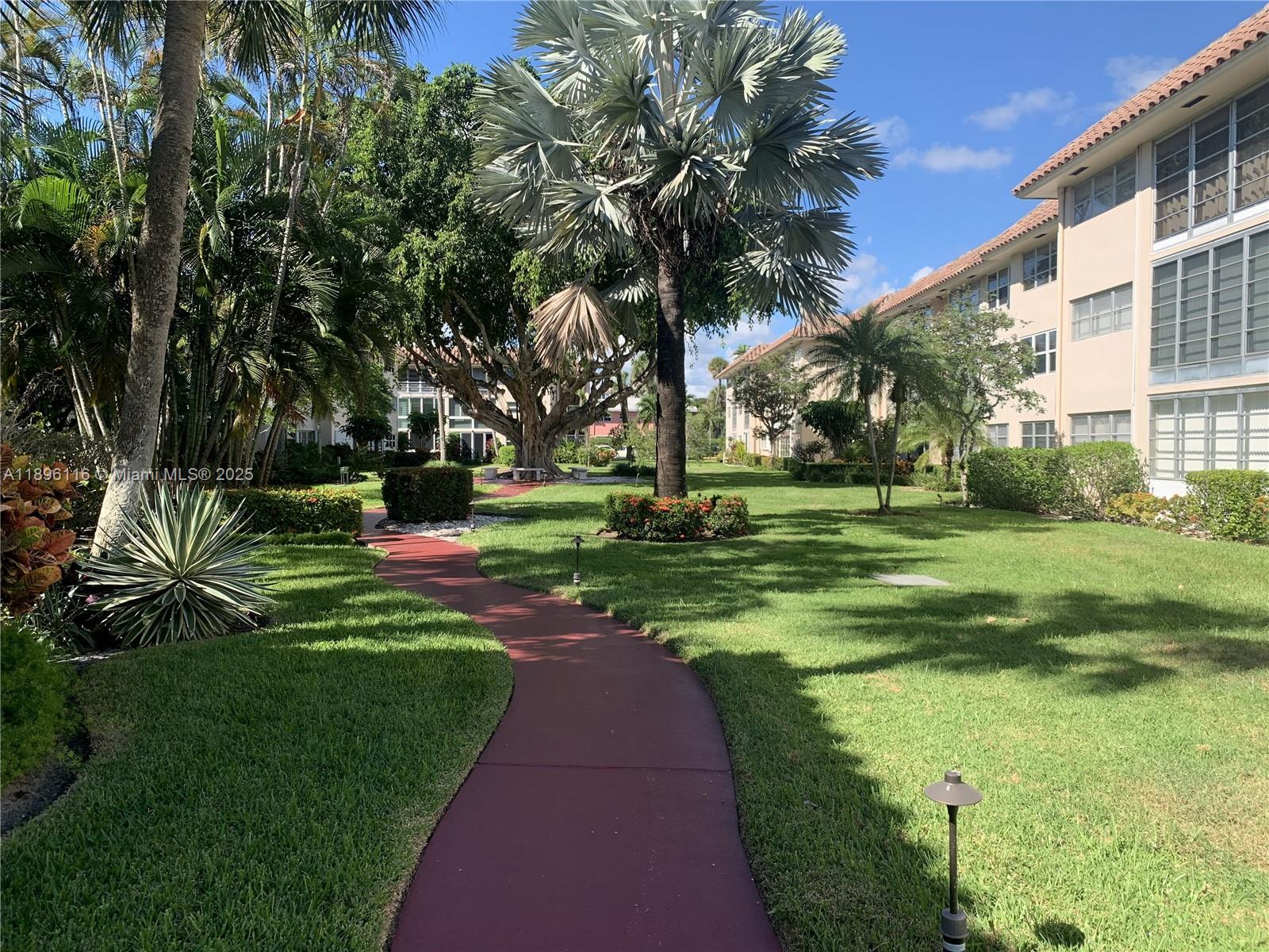 400 Northeast 20th Street, Unit A108 Boca Raton, FL 33431 - Photo 24 of 35 a view of a park with large trees