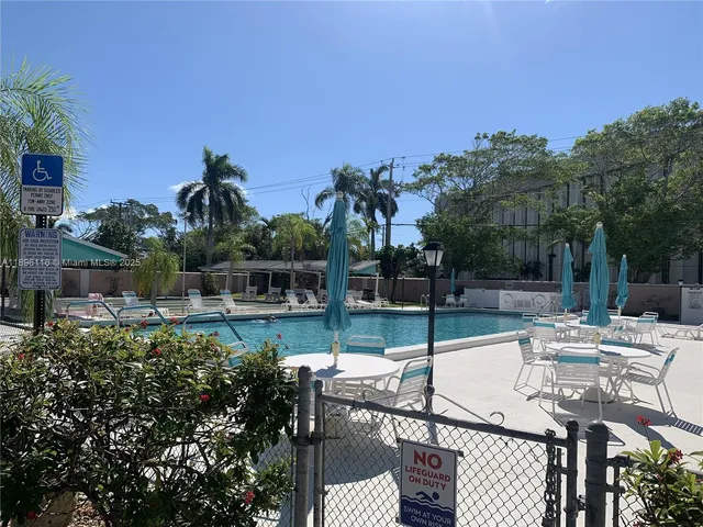 a view of a swimming pool with a patio