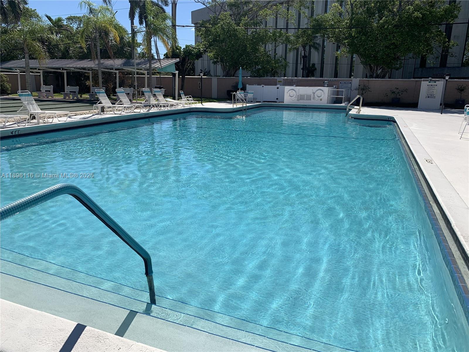 400 Northeast 20th Street, Unit A108 Boca Raton, FL 33431 - Photo 27 of 35 a view of a swimming pool with a patio