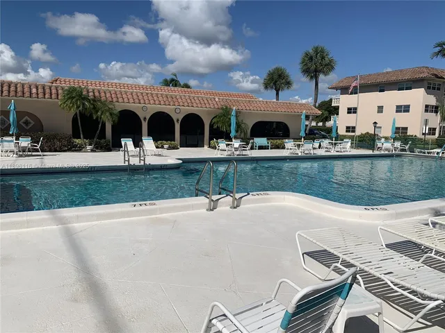 a view of a swimming pool with a patio