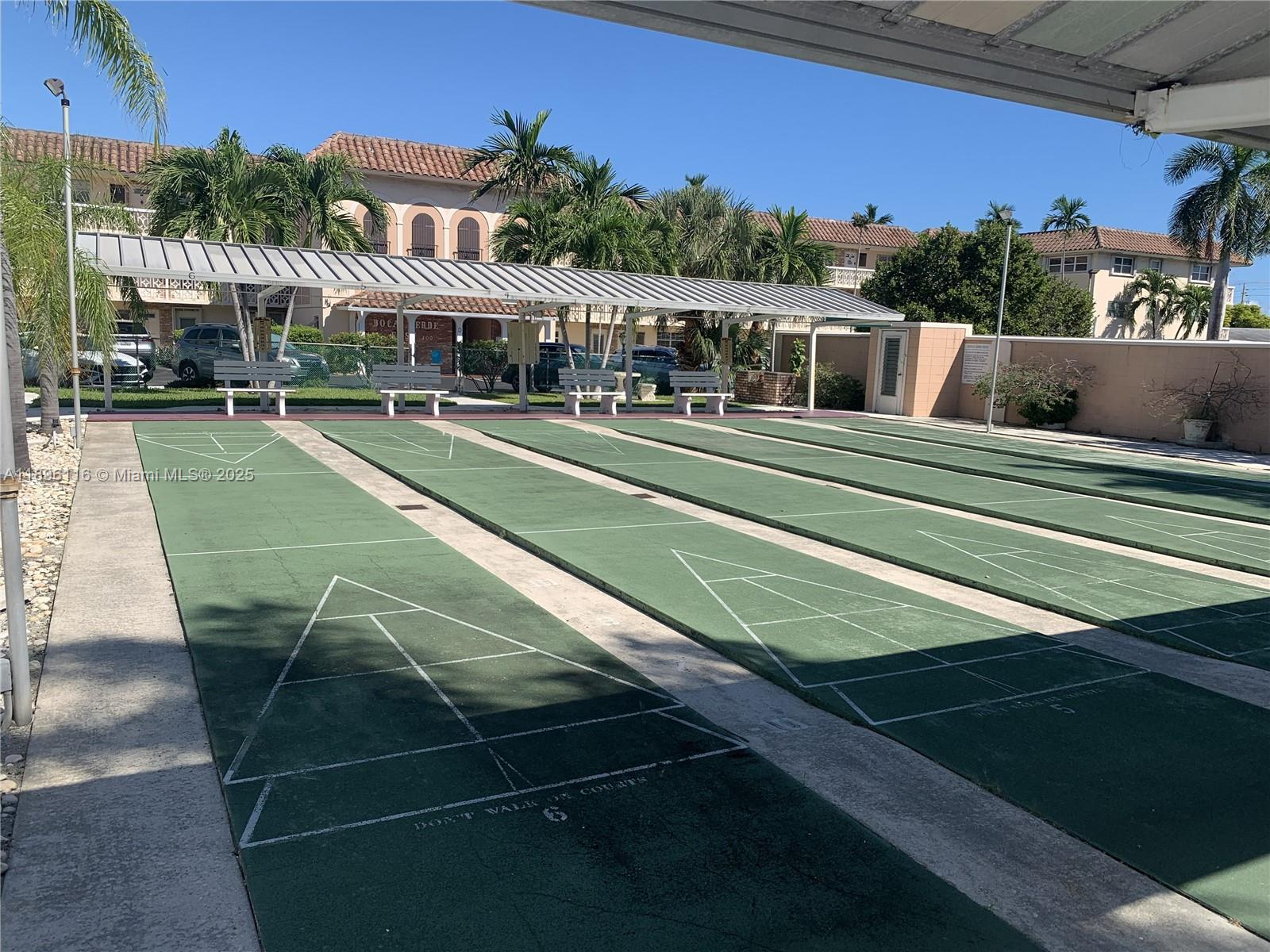400 Northeast 20th Street, Unit A108 Boca Raton, FL 33431 - Photo 29 of 35 a view of a swimming pool with a patio