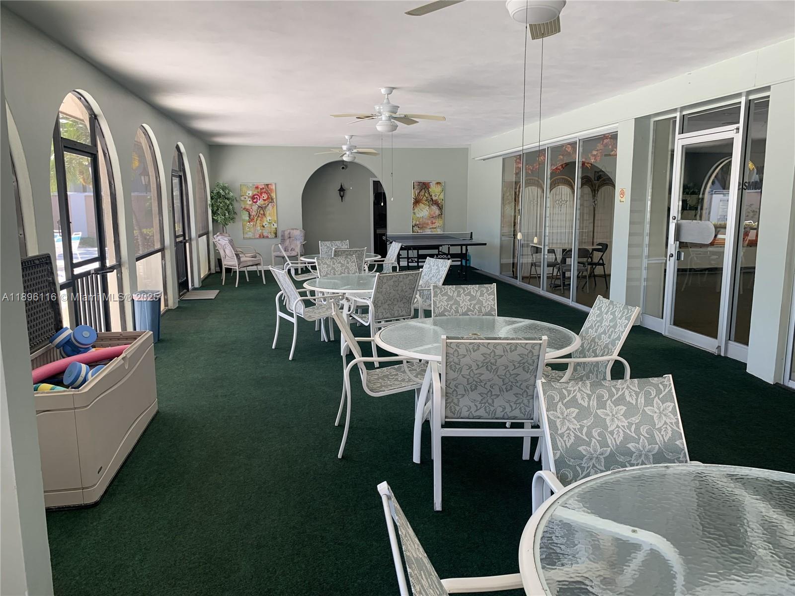 400 Northeast 20th Street, Unit A108 Boca Raton, FL 33431 - Photo 32 of 35 a living room with dining room and furniture