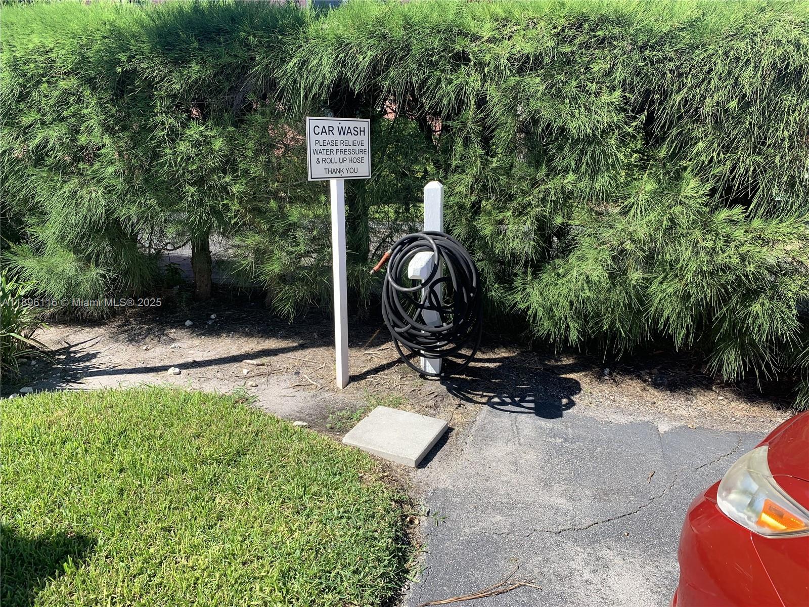 400 Northeast 20th Street, Unit A108 Boca Raton, FL 33431 - Photo 35 of 35 a backyard of a house with barbeque oven and tree