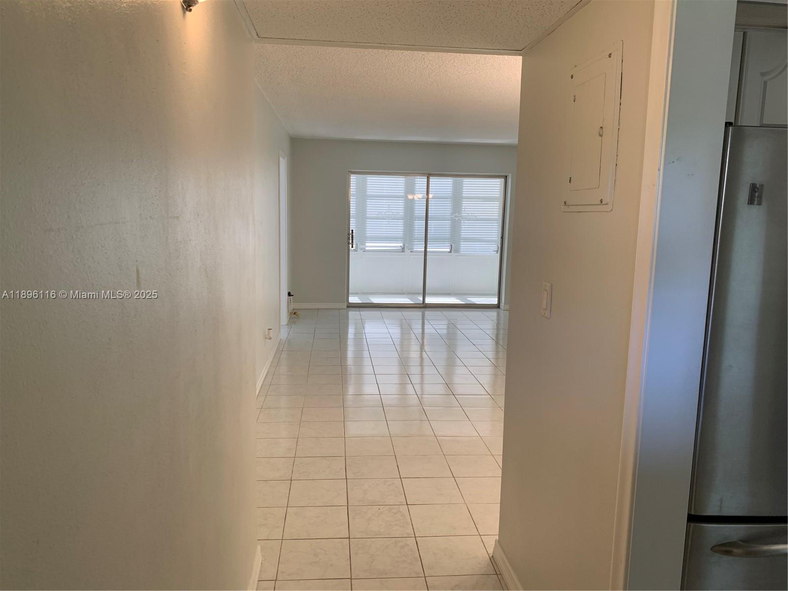 400 Northeast 20th Street, Unit A108 Boca Raton, FL 33431 - Photo 5 of 35 a view of an empty room and window
